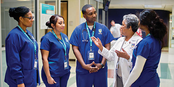 A group of Chamberlain students in scrubs