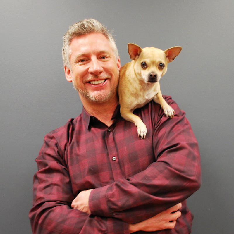 Man with small dog on his sholder